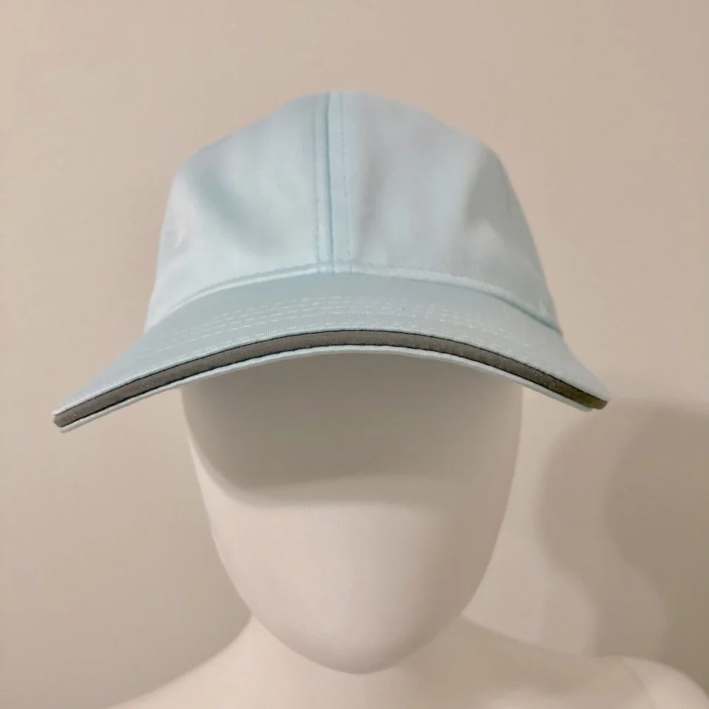 light blue baseball cap with reflective stripe on the peak self-adjusting .